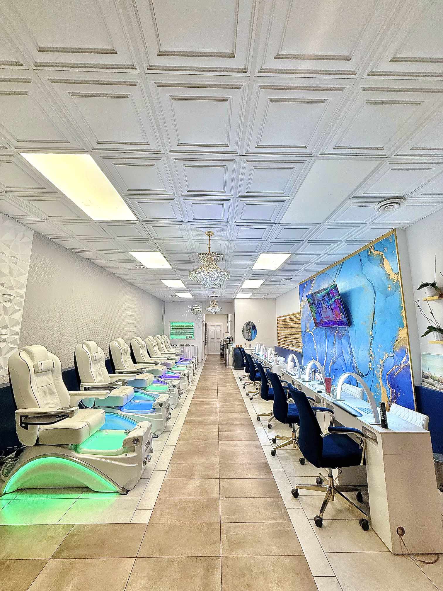 Interior of Q Nails Westgate with manicure stations and spa pedicure chairs